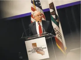  ?? Stephen Lam / Getty Images ?? Attorney General Jeff Sessions addresses a California Peace Officers’ Associatio­n conference last month in Sacramento. In a lawsuit against California, his agency seeks to nullify a new state law that tries to give the state power to veto sales of...