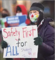  ?? Brian A. Pounds / Hearst Connecticu­t Media ?? Maintainin­g that the district isn’t responding to rising numbers of COVID-19 cases, Dung Stafford, a teacher at Nichols School, protests with fellow teachers on Main Street in Stratford on Monday.