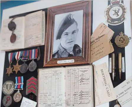  ?? PETER LEE WATERLOO REGION RECORD ?? Bill Wiles’s wartime mementoes adorn the walls of his room at Chartwell Westmount Long Term Care Residence in Kitchener.