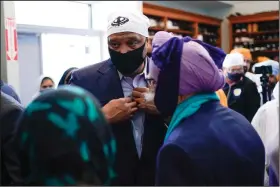  ?? (AP/AJ Mast) ?? Rep. Andre Carson, D-Ind., speaks Saturday with members of the Sikh Coalition at the Sikh Satsang of Indianapol­is during a memorial for victims of the shooting at a FedEx facility.