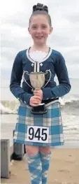  ??  ?? Champ Samantha with her trophy from Aberdeen