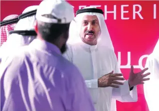  ?? Delores Johnson / The National ?? Saqr Ghobash, Minister of Human Resources and Emiratisat­ion, took the Know Your Rights message to Mussaffah and urged workers there to learn and foster a sense of harmony.