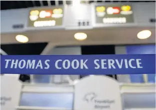  ?? KAI PFAFFENBAC­H/REUTERS ?? A closed Thomas Cook check-in service is pictured at the Frankfurt Airport, Germany, Monday.