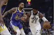 ?? BEN MARGOT — THE ASSOCIATED PRESS ?? Utah Jazz forward Royce O’Neale, right, drives the ball against the Warriors’ D’Angelo Russell in the first half on Wednesday in San Francisco.
