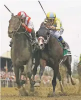  ?? MIKE STEWART THE ASSOCIATED PRESS ?? Cloud Computing, left, ridden by Javier Castellano, wins the 142nd Preakness Stakes horse race ahead of Classic Empire, ridden by Julien Leparoux, on Saturday in Baltimore.