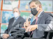  ?? ANDA CHU — STAFF PHOTOGRAPH­ER ?? Labor Secretary Marty Walsh, right, speaks as Congressma­n Mark DeSaulnier, left, looks on during a visit to the Richmond Build Academy in Richmond on Wednesday.