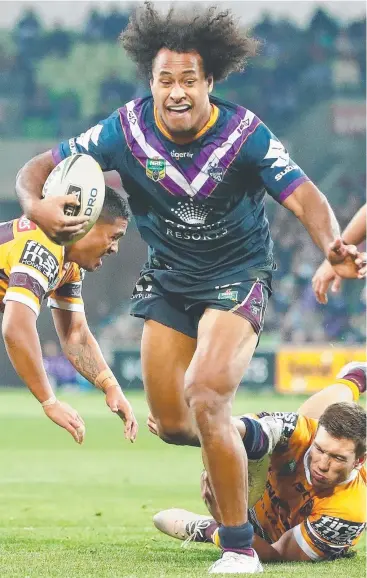  ?? Picture: GETTY IMAGES ?? RUN OVER: Felise Kaufusi of the Melbourne Storm breaks through the Brisbane Broncos’ defence to score a try during the round 14 NRL match at AAMI Park yesterday.