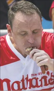  ?? Eduardo Munoz Alvarez / Getty Images ?? Joey Chestnut was the winner once again in the annual Nathan’s Hot Dog Eating Contest on July 4.