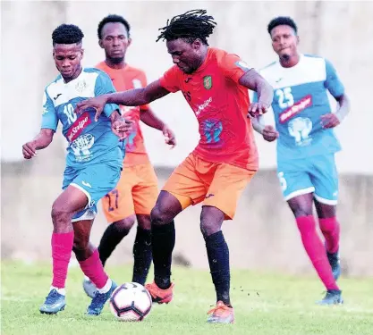  ?? FILE ?? Rodico Wellington (second right) of Tivoli Gardens moves past Lamar Walker (left) of Portmore United during a Red Stripe Premier League fixture at Spanish Town Prison Oval on Sunday, March 1, 2020.