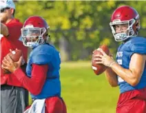  ?? AP PHOTO/SUE OGROCKI ?? Oklahoma quarterbac­ks Jalen Hurts, left, and Tanner Mordecai throw during practice on Aug. 5 in Norman, Okla.