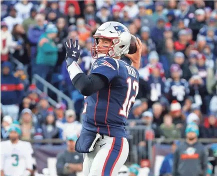  ?? WINSLOW TOWNSON/USA TODAY SPORTS ?? Patriots quarterbac­k Tom Brady passes against the Dolphins on Dec. 29 in Foxborough, Mass. Brady is on the cusp of becoming the biggest free agent to hit the open market since Peyton Manning in 2013.