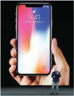  ??  ?? APPLE’S NEWEST BABY – Phil Schiller, Apple’s senior vice president of worldwide marketing, at the launch of the iPhone X at the Steve Jobs Theater on the new Apple campus in Cupertino California, Tuesday. (AP)