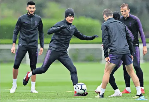  ??  ?? Look and learn: Dele Alli tries to find a way through his team-mates; and (inset) coach Mauricio Pochettino