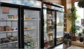  ??  ?? Coolers with all-vegan food products are on display at the 100 percent plant based grocery store located in Boyertown.