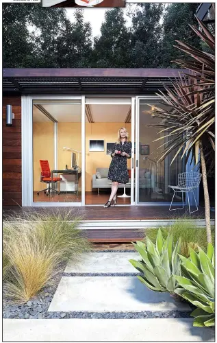  ?? Special to The Washington Post/DOUGLAS HILL ?? Chelsea Hadley relaxes outside her luxury storage-shed conversion in Beverly Hills, Calif. She uses it for a retreat and for an office.