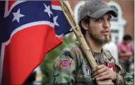  ?? Photo by Evelyn Hockstein for The Washington Post ?? Ben, a 21-yearold KKK member from Harrison, Arkansas, attends the rally of white nationalis­t groups at Emancipati­on Park Saturday.