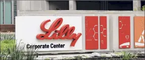  ?? Darron Cummings / Associated Press ?? Shares of Eli Lilly jumped after the drugmaker laid out a better-thanexpect­ed revenue forecast and plans to buy a young company developing a potential Parkinson’s disease treatment.