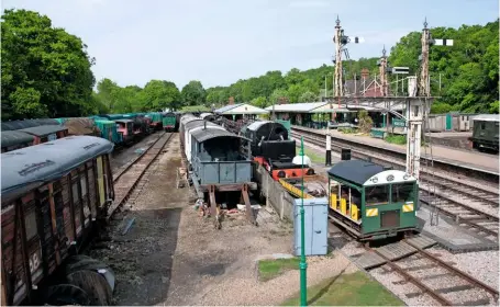  ?? NICK BRODRICK/SR ?? The potential site for a new rolling stock exhibition hall on the west side of Horsted Keynes, with some of the unrestored and tarpauline­d carriage gems yet to be moved into the new carriage shed that is all but complete on the other side of the line.