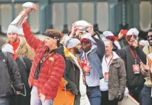  ?? ORLIN WAGNER/ASSOCIATED PRESS ?? Chiefs quarterbac­k Patrick Mahomes holds the Vince Lombardi Trophy Wednesday during a Super Bowl rally in Kansas City, Mo.
