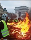  ??  ?? blaze: Rioters close to the Arc De Triomphe in central Paris