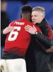  ?? — Reuters ?? Manchester United interim manager Ole Gunnar Solskjaer embraces Paul Pogba at the end of the match against Chelsea in FA Cup.