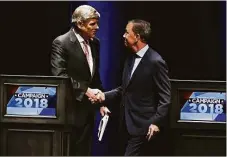  ?? Associated Press file photo ?? Republican Bob Stefanowsk­i, left, shakes hands with Gov. Ned Lamont at a 2018 gubernator­ial debate at the University of Connecticu­t.
