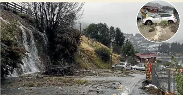  ?? DEBBIE JAMIESON/STUFF ?? A water main burst in Queenstown after being hit by a contractor. The resulting surge of gravel shunted cars across a road.