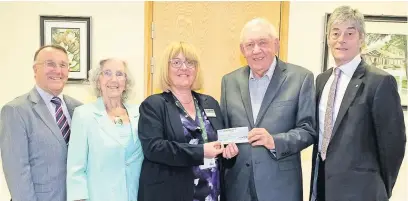  ??  ?? ●●At the handover of Fred and Mary Bottomley’s windfall are (from left) Ken Davies MBE, former hospice fundraisin­g manager and trustee, June Rowlands, Julie Halliwell, hospice chief executive, Ray Farrell and Robert Clegg OBE, chairman of the hospice...