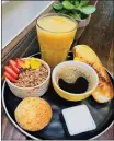  ?? COURTESY OF WORLD GREEN ACAI ?? World Green Açaí Bowl-Juice's combo breakfast features a cup of coffee, toasted bread, mini açaí bowl, Brazilian cheese bread and a glass of orange juice.