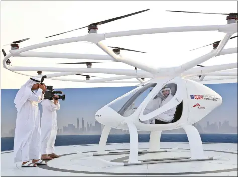  ?? REUTERS ?? Dubai Crown Prince Sheikh Hamdan bin Mohammed bin Rashid Al Maktoum is seen inside the flying taxi in Dubai, United Arab Emirates on Monday.