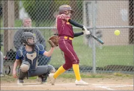  ?? Photo by Becky Polaski ?? Tessa Fledderman connects with a pitch for a leadoff single for the Lady Crusaders in the bottom of the third inning.