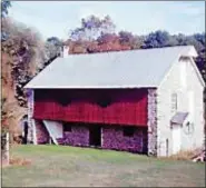  ??  ?? Shown here is the Keim barn when its forebay was repainted by the Society in the early 1970s in anticipati­on for their Colonial Cherry Fair.