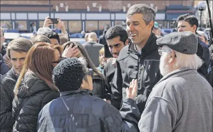  ?? Chip Somodevill­a / Getty Images ?? Democratic presidenti­al candidate Beto O’rourke greets voters during a canvassing kickoff event with state senate candidate Eric Giddens on Saturday in Waterloo, Iowa. After losing a long shot race for U.S. Senate to Ted Cruz, R-tex., the 46-year-old O’rourke is making his first campaign swing through Iowa after jumping into a crowded Democratic field last week.