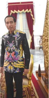  ??  ?? JAKARTA: Indonesian President Joko Widodo gets up after an exclusive interview with AFP at the Merdeka Palace in Jakarta. — AFP