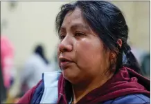  ?? ?? Lucia Mendoza, 37, of Pajaro cries in the evacuation center at the Santa Cruz County Fairground­s in Watsonvill­e on Sunday. Many in the farmworker community evacuated.