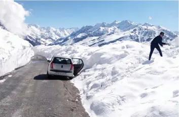  ?? — PTI ?? A traveller halts near the Rohtang Pass after the road leading to Lahaul-Spiti district was opened by the Border Roads Organisati­on (BRO) on Friday.