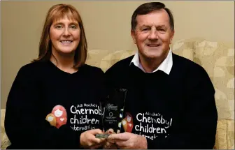  ?? Photo by Domnick Walsh ?? George and Mary Sugrue at home in Kerry with their Community Hero award - the nation’s top honour for volunteeri­sm, awarded in their case for their unstinting, hard work on behalf of the Adi Roche’s Chernobyl Children Internatio­nal charity over recent...