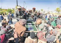  ?? AFP ?? Houthi rebels surround the coffins of fellow combatants killed in battles with Saudi-backed troops, during a mass funeral at Sana’a’s al-Saleh mosque.