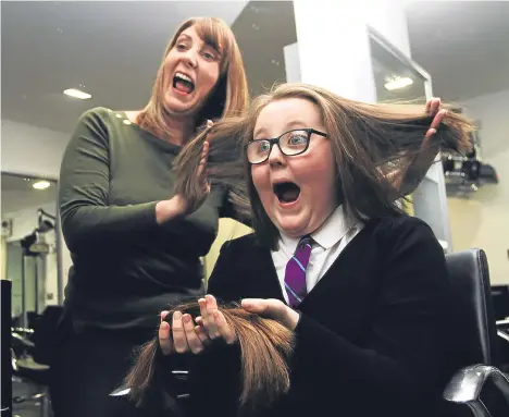  ??  ?? ZARAH Anderson, a nine-year-old girl from Trottick, had 12 inches of her hair cut in aid of the charity The Little Princess Trust.The charity makes wigs from real hair for children who have cancer.A wig costs £500 to produce and Zarah’s effort so far has raised more than £400.