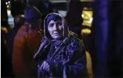  ?? VASILY KRESTYANIN­OV — THE ASSOCIATED PRESS ?? An ethnic Armenian woman from Nagorno-Karabakh stands near a tent camp after arriving to Armenia's Goris in the Syunik region, Armenia, late Friday.