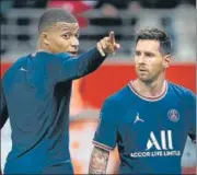  ?? AFP ?? Kylian Mbappe (L) talks to Lionel Messi after PSG’S French league match against Reims on Sunday.