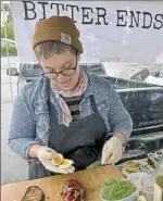  ?? Pam Panchak/Post-Gazette photos ?? Left: Aeros Lillstrom, with Who Cooks For You Farm from New Bethleham, talks with customers at the Bloomfield Saturday Market. Right: Becca Hegarty, who co-owns Bitter Ends Garden & Luncheonet­te in Verona, prepares one of her signature vegetarian...