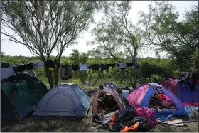  ?? (AP/Fernando Llano) ?? Venezuelan migrants rest inside their tents Sunday on the bank of the Rio Grande in Matamoros,
Mexico.