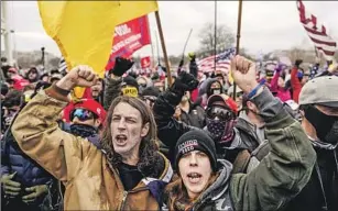  ?? Photos from top: Kent Nishimura Los Angeles Times Wally Skalij Los Angeles Times Charles Rex Arbogast Associated Press Gemunu Amarasingh­e Associated Press ?? FROM TOP: Rioters at the U.S. Capitol, Jan. 6, 2021; a rally in Santa Monica, August 2021; an FBI team in Highland Park, Ill., July 5; a demonstrat­ion at the Supreme Court, June 24.