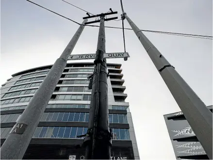  ?? ?? This tram pole, centre, is recommende­d by the city council for heritage protection, as the last one left in Wellington.