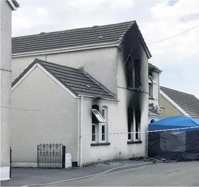  ??  ?? The scene after the arson attack at the house in Mansel Street in Burry Port.