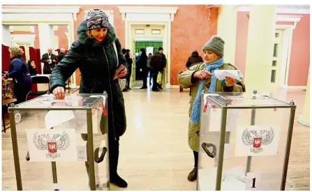  ??  ?? Doing their duty: Women casting their ballots at a polling station in Donetsk. — AFP