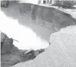  ??  ?? Portion of the road between Kuka and Yaba washed away by flood yesterday