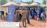  ??  ?? Public Health Inspectors attend a Dogstar Foundation spay neuter clinic in Ja-ela Sri Lanka