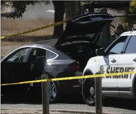  ?? NHAT V. MEYER— STAFF PHOTOGRAPH­ER ?? The Santa Clara County Sheriffs Department investigat­es a vehicular incident at the entrance to Rancho San Antonio Preserve in Cupertino on Tuesday. One pedestrian was struck by a car and died. Another person suffered minor injuries.